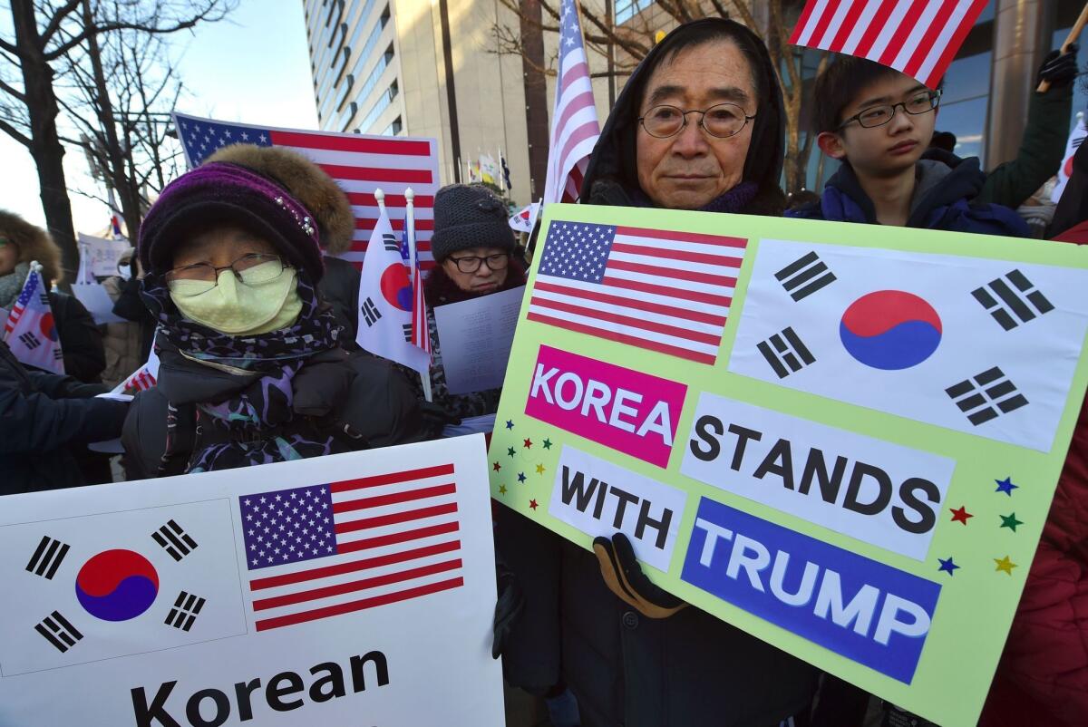 South Korean Christians hold placards during a rally Feb. 2 in Seoul to welcome the visit of Defense Secretary James Mattis.