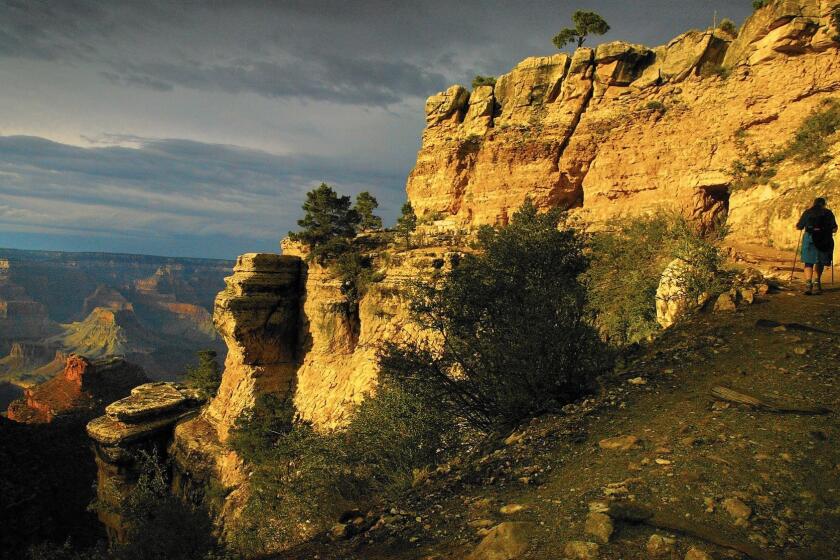 Hikers traverse the Bright Angel Trail at the Grand Canyon.