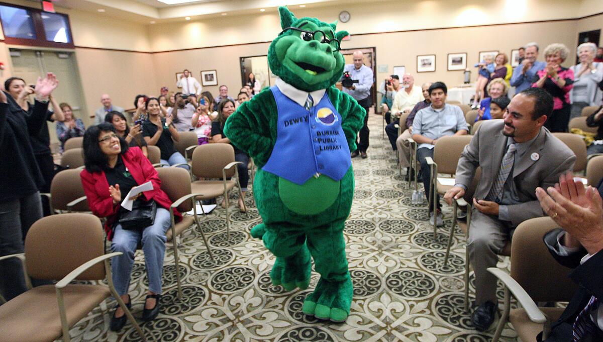 The new library mascot "Dewey" is introduced at the Buena Vista branch n Wednesday, May 21. 2014.