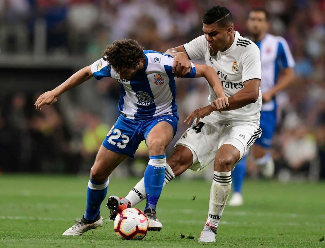 Espanyol's Spanish midfielder Esteban Granero (L) vies with Real Madrid's Brazilian midfielder Casemiro during the Spanish league football match between Real Madrid CF and RCD Espanyol at the Santiago Bernabeu stadium in Madrid on September 22, 2018. (Photo by JAVIER SORIANO / AFP)JAVIER SORIANO/AFP/Getty Images ** OUTS - ELSENT, FPG, CM - OUTS * NM, PH, VA if sourced by CT, LA or MoD **