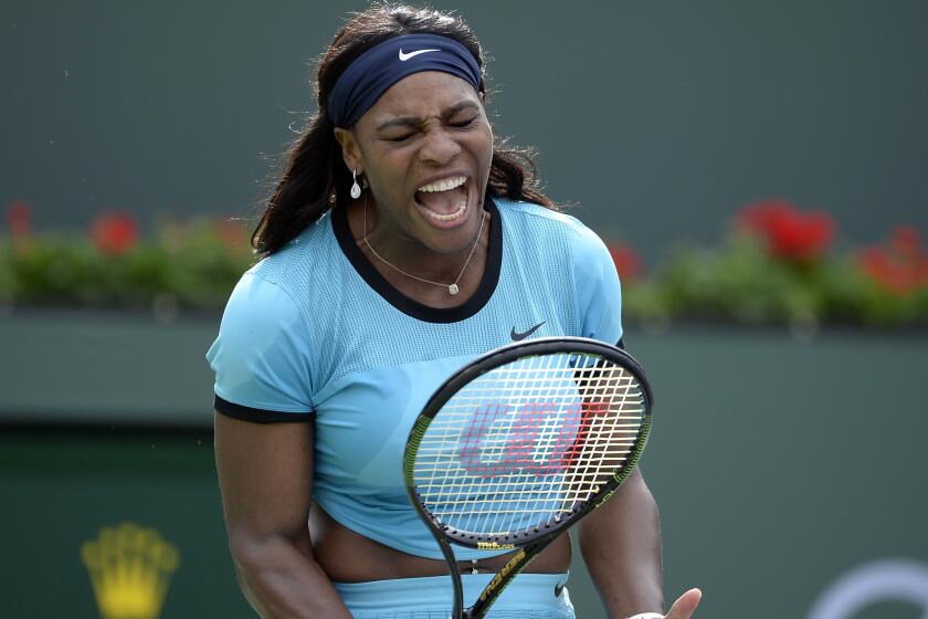 Serena Williams reacts after a point during her third round match against Yulia Putintseva at the BNP Paribas Open at Indian Wells.