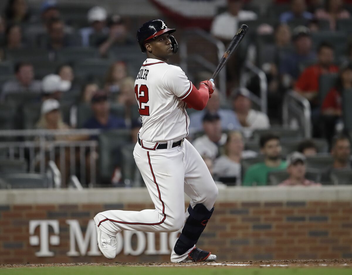 Atlanta Braves' Jorge Soler swings for an RBI double in the fifth inning of a baseball game against the Miami Marlins Saturday, Sept. 11, 2021, in Atlanta. (AP Photo/Ben Margot)