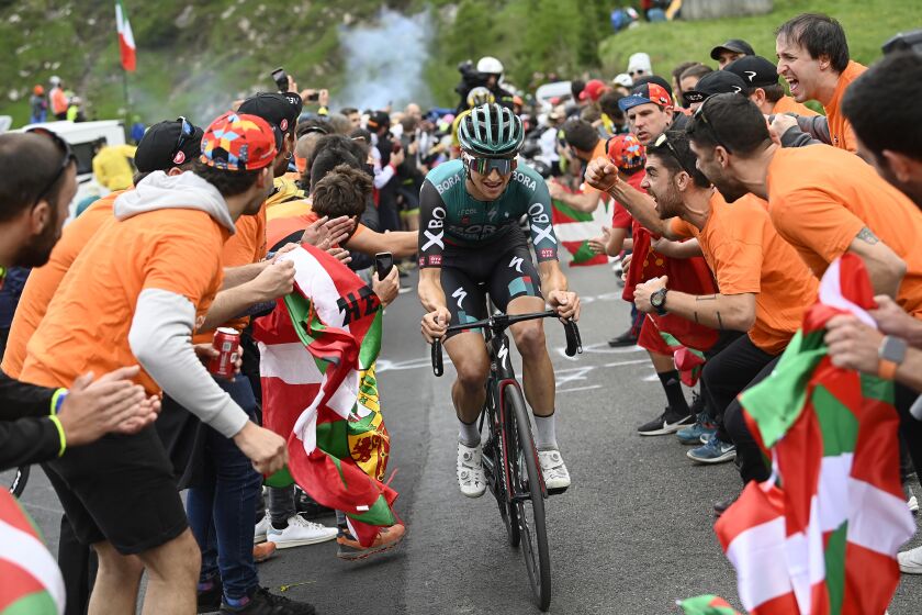 FILE - Australia's Jai Hindley competes during the 20th stage of the Giro D'Italia cycling race, from Belluno to Passo Fedaia, Italy, on May 28, 2022. Next year's Giro d'Italia will start in the region of Abruzzo. Race organizers announced Wednesday, Sept. 28, 2022 that the 2023 edition will run May 6-28 and begin with an 18.4-kilometer (11.4-mile) time trial on the Adriatic coast. (Fabio Ferrari/LaPresse via AP, File)