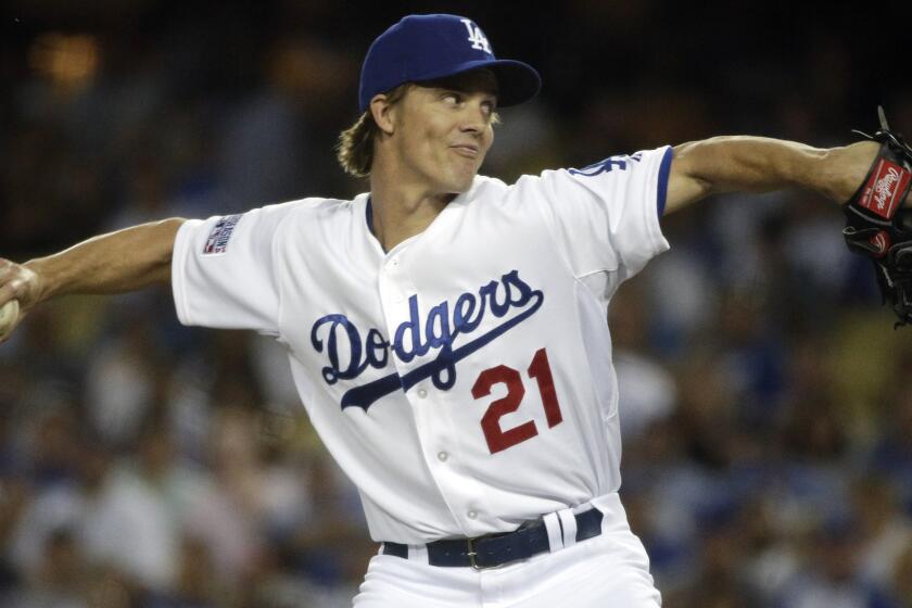 Dodgers starter Zack Greinke delivers a pitch during Game 2 of the National League division series against the St. Louis Cardinals on Oct. 4.
