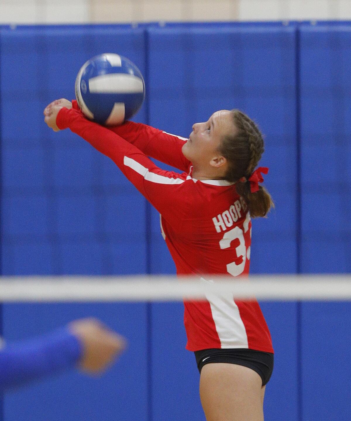 Burroughs' Natalie Hooper reaches to the back court to keep a the ball in play against Burbank in a Pacific League girls' volleyball match at Burbank High School on Tuesday, September 24, 2019. Burroughs swept the match 3-0.