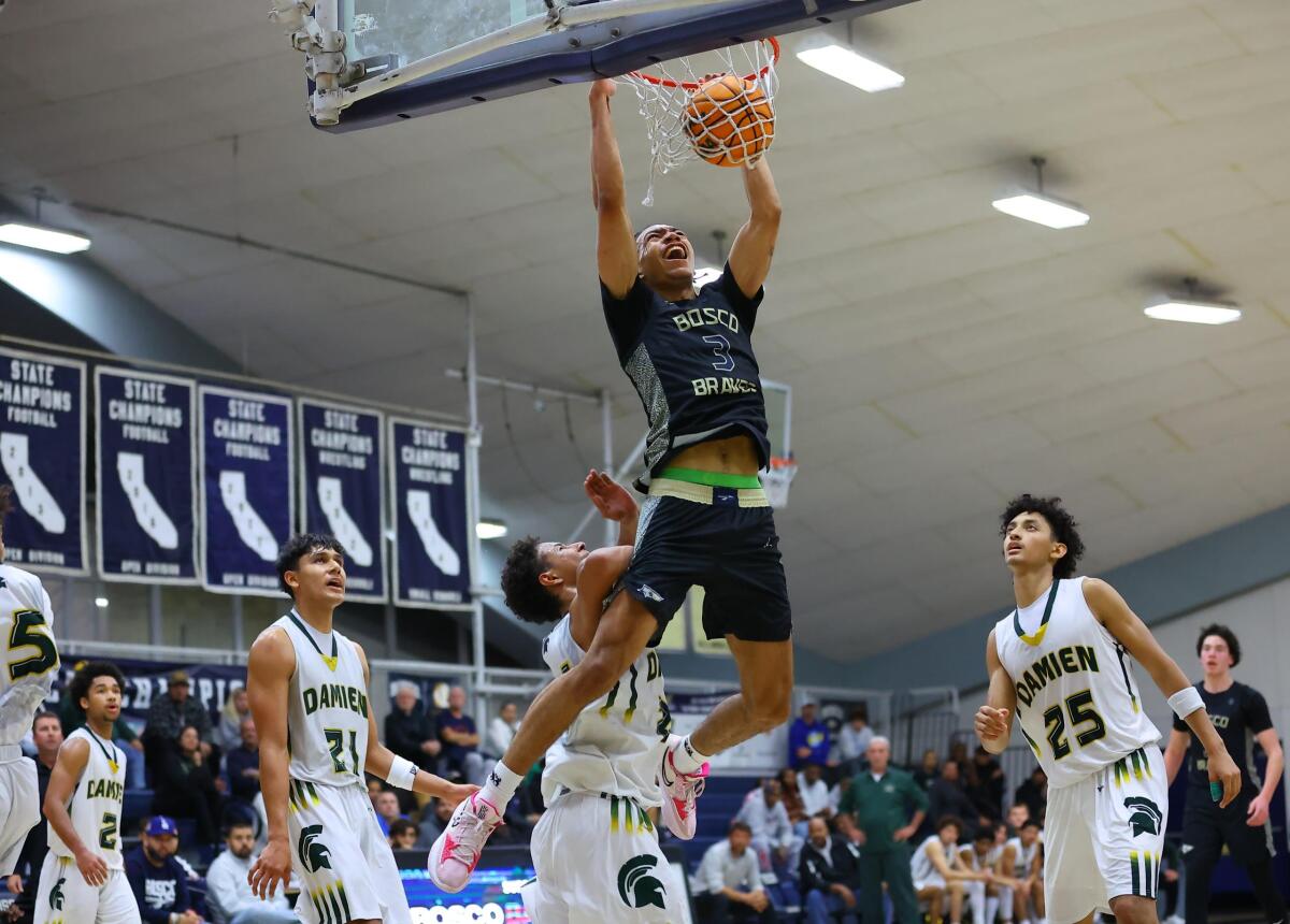 Elzie Harrington of St. John Bosco dunks during a win over Damien in the championship game of the St. John Bosco tournament.