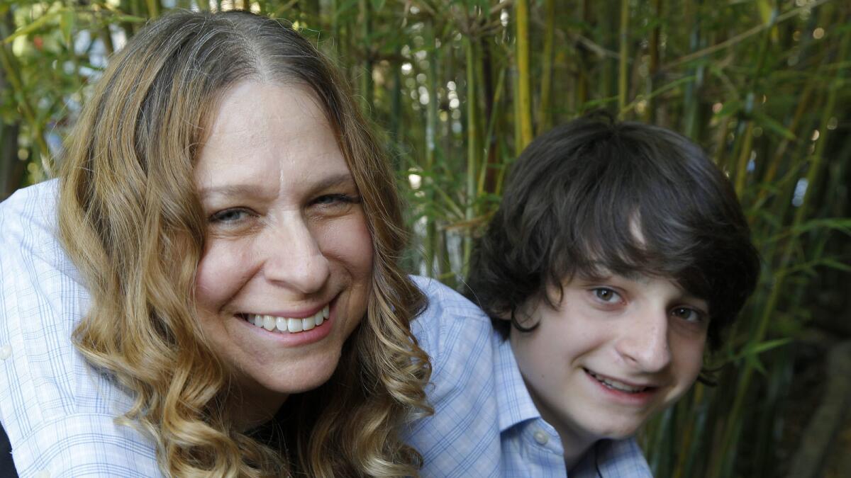 Miles Bakshi, right, the teenager who supplied the voice of the 7-year-old brother in the animated comedy "The Boss Baby," with his mother, producer Gina Shay.