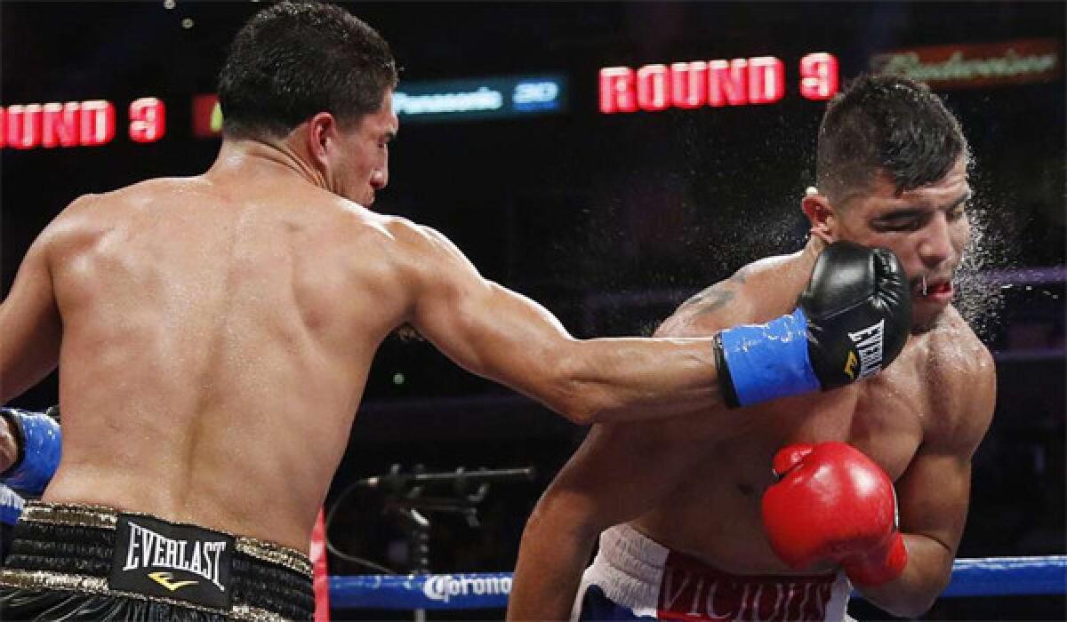 Josesito Lopez, left, delivers a punch to Victor Ortiz during the ninth round of a WBC welterweight boxing match in June.