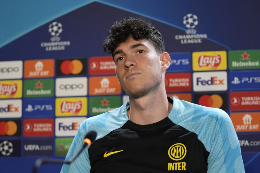 Inter Milan's Alessandro Bastoni waits the start of the press conference during a media day ahead of the Champions League soccer final, at the Suning training center, in Appiano Gentile, northern Italy, Monday, June 5, 2023. Inter Milan will play a Champions League final against Manchester City in Istanbul, Turkey, next Saturday, June 10. (AP Photo/Antonio Calanni)