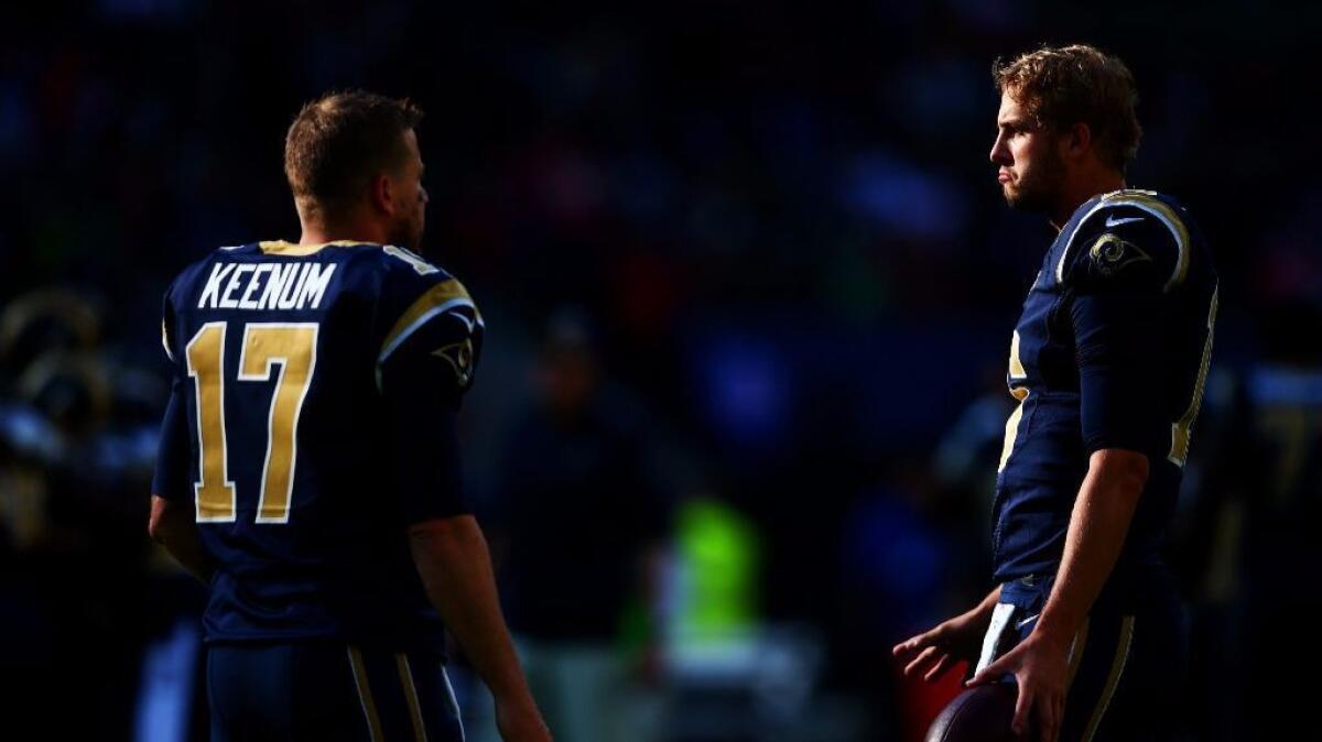 Rams quarterbacks Case Keenum and Jared Goff talk before an International Series game against the Giants in London on Oct. 23.
