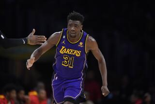Los Angeles Lakers' Thomas Bryant (31) makes his way down the court during the second half of an NBA basketball game against the Atlanta Hawks Sunday, Jan. 8, 2023, in Los Angeles. (AP Photo/Jae C. Hong)