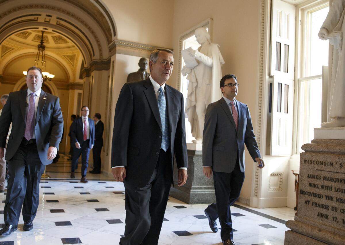 Speaker John Boehner (R-Ohio) leaves the House chamber on Capitol Hill after Republicans failed to continue funding for the Department of Homeland Security.