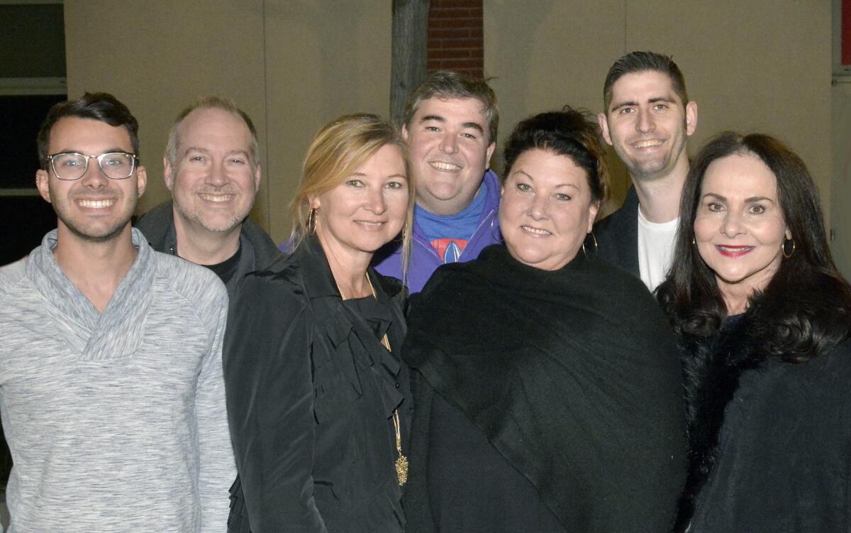 From left, Justin Klotzle, Brett Carroll, Jessica Good, Brendon Jennings, Peggy Flynn and Taylor Arakelian, all with Burbank Unified, pose with April Williams, president and founder of the Musicians at Play Foundation, prior to a fundraiser concert called “A Far Off Place" presented last week.