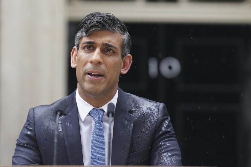 Britain's Prime Minister Rishi Sunak delivers a statement, outside 10 Downing Street, London, Wednesday, May 22, 2024. Sunak has set the date of July 4, 2024 for the national election to determine who governs the UK. (Stefan Rousseau/PA via AP)