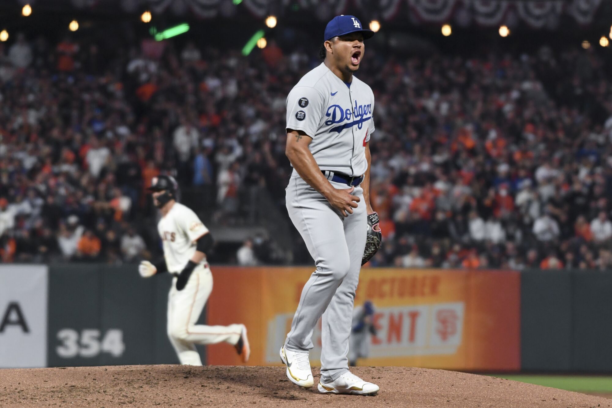 Los Angeles Dodgers relief pitcher Brusdar Graterol reacts after striking out San Francisco Giants' Logan Webb