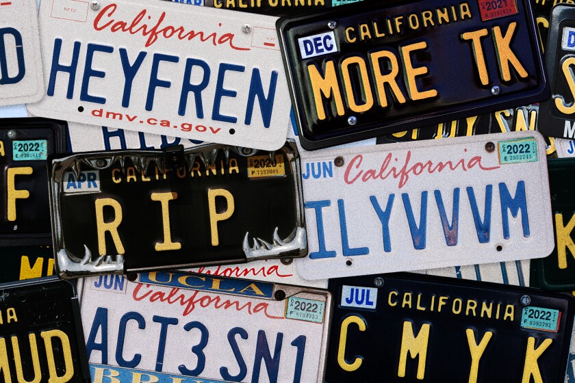 a pile of license plates with different phrases on them like "R I P" and "MORE TK"