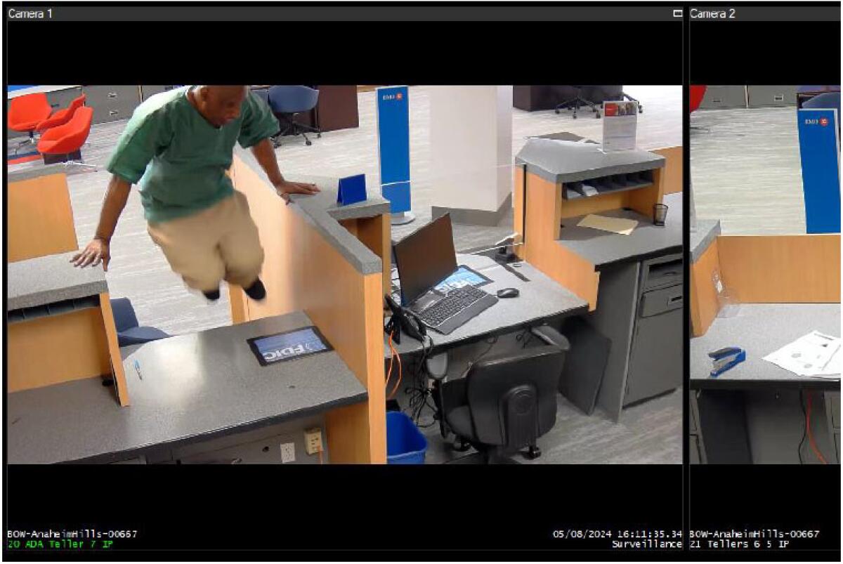 Surveillance camera image shows a man authorities identified as Walter Gray hopping over a counter during a bank robbery.
