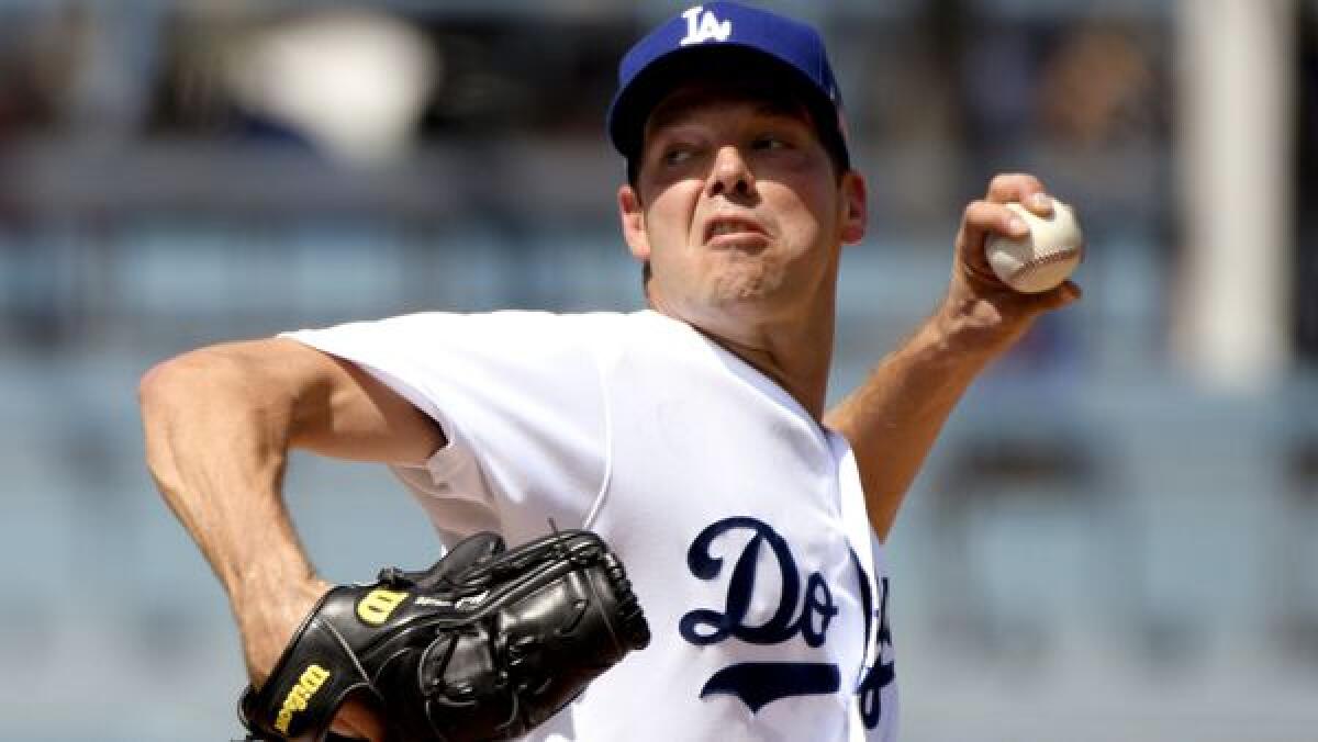 Dodgers pitcher Rich Hill throws to the plate during the second inning against the Colorado Rockies on Sept. 10.