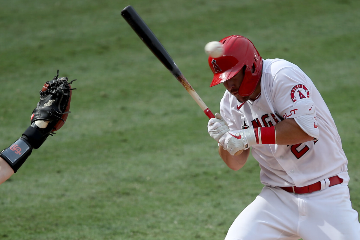 Mike Trout ducks a high pitch.