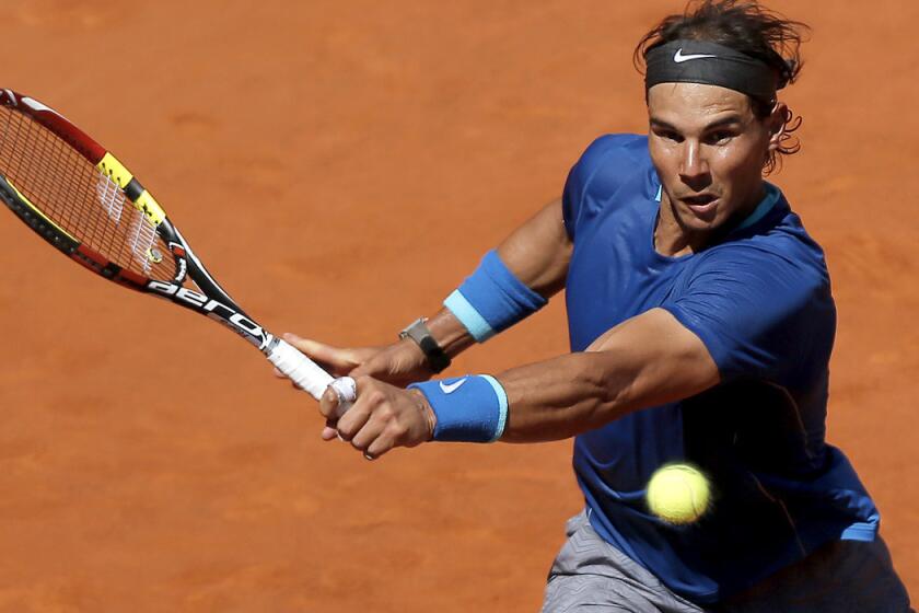 2Rafael Nadal tracks down a shot by Tomas Berdych during a quarterfinal match at the Madrid Open on Friday.