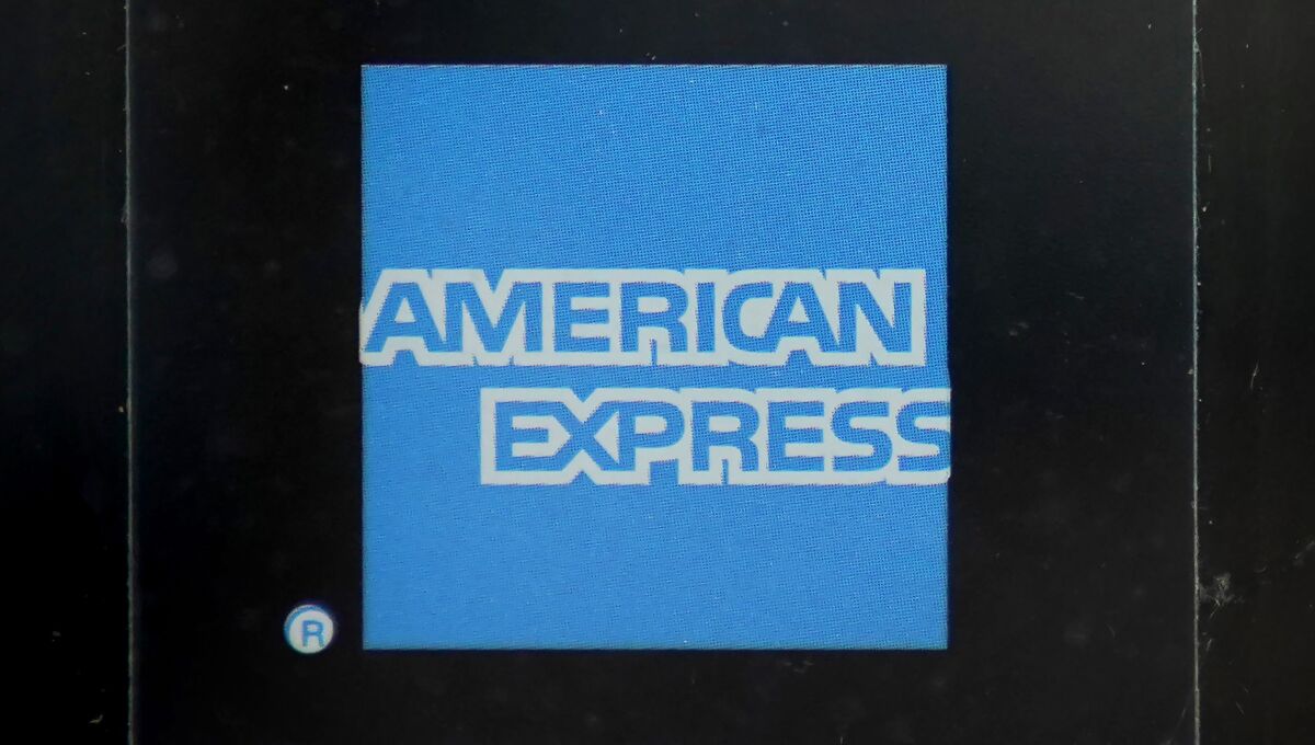 FILE - An American Express logo is attached to a door in Boston's Seaport District, Wednesday, July 21, 2021. American Express reports earnings on Friday, Jan. 27, 2023. (AP Photo/Steven Senne)