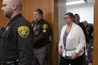 Jennifer Crumbley walks into the Oakland County courtroom of Judge Cheryl Matthews before being found guilty on four counts of involuntary manslaughter on Tuesday, Feb. 6, 2024 in Pontiac, Mich. Prosecutors say Crumbley was grossly negligent when she failed to tell Oxford High School that the family had guns, including a 9 mm handgun that her son, Ethan Crumbley, used at a shooting range on the weekend before the Nov. 30, 2021, attack. (Mandi Wright/Detroit Free Press via AP, Pool)