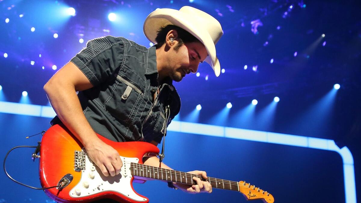 Brad Paisley, who's set to co-host Wednesday's CMA Awards, was among the country artists who criticized a memo from the association forbidding journalists from asking about guns and politics.