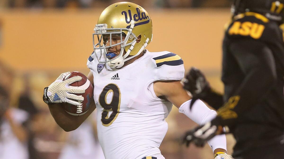 UCLA wide receiver Jordan Payton scores on an 80-yard touchdown reception during a win over Arizona State on Thursday. Payton has emerged as one college football's top receivers.