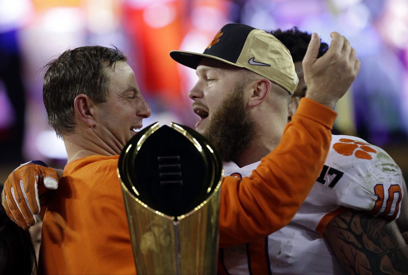 Clemson Coach Dabo Swinney celebrates with linebacker Ben Boulware during the award ceremony after the Tigers defeated Alabama, 35-31, in the College Football Playoff national title game.