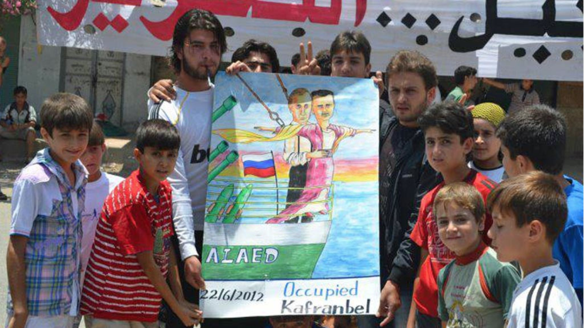 A poster from anti-government activists in Kafranbel depicting Syrian President Bashar Assad and Russian President Vladimir Putin.