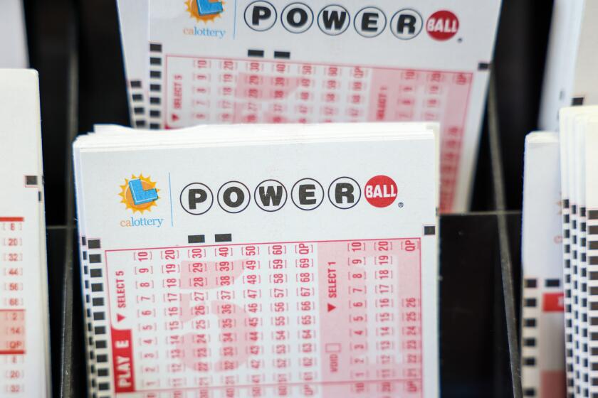 Hawthorne, CA - October 10: Powerball play tickets on display at Blue Bird Liquor in Hawthorne, CA, Tuesday, Oct. 10, 2023. The estimated jackpot for tonight's Powerball drawing is $1.73 Billion.(Jay L. Clendenin / Los Angeles Times)