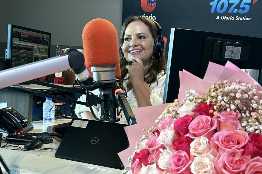 Levantate syndicated morning radio show co-host Maria Elena Nava on her first day on air at KLVE 107.5 FM radio in Los Angeles on Thursday, Sept. 14, 2023. Nava shot to fame in radio at the same station in the 1990's while program director, creating the format that is now replicated by many other Spanish-language radio stations.