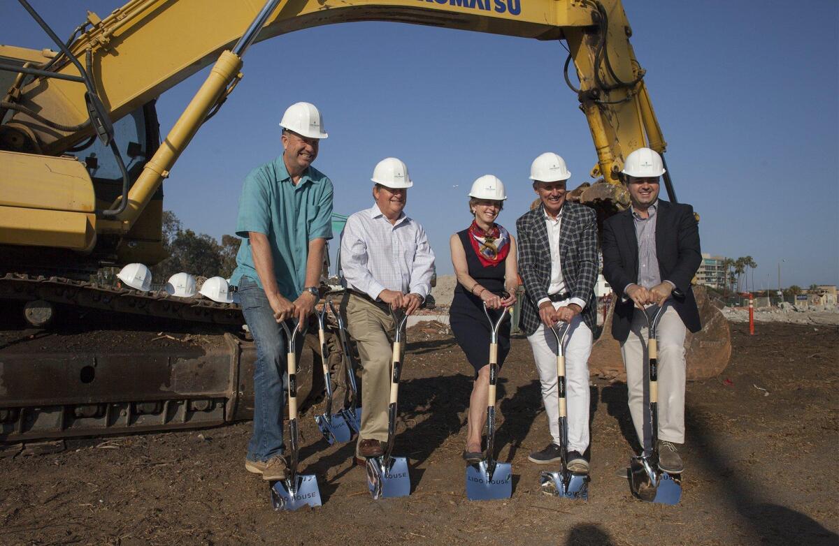 Bob Olson of R.D. Olson Development, second from right, joins Newport Beach Mayor Diane Dixon and other members of the City Council during the groundbreaking ceremony Wednesday for the Lido House Hotel.