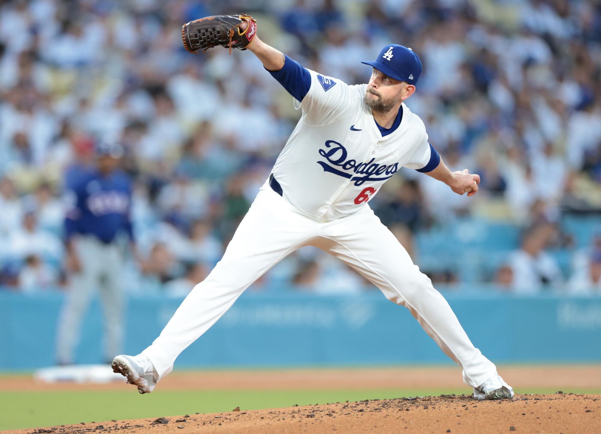 Dodgers pitcher James Paxton delivers against the Texas Rangers in June.
