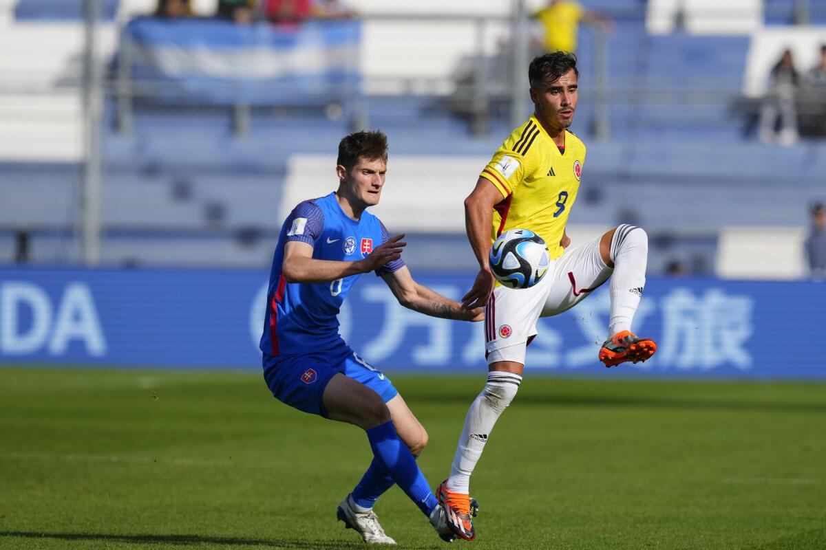 Tomás ?ngel, right, tries to control a pass from a Colombia teammate during a FIFA U-20 World Cup game against Slovakia.