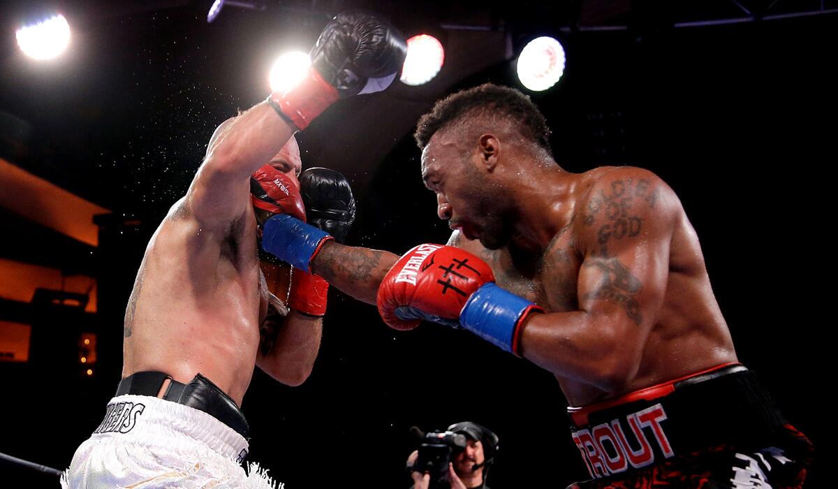 Austin Trout, right, lands a right hand to the head of Joey Hernandez during their Junior Middleweight bout at Hollywood Palladium on Tuesday.