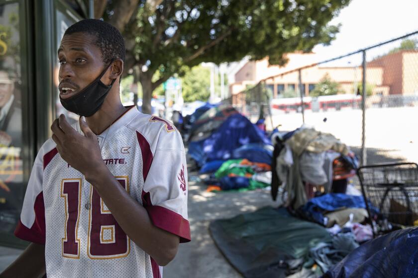LOS ANGELES, CA-JUNE 3, 2020: Karl Hamilton, 39, who has been homeless for the past 8 months is photographed outside his tent at a homeless encampment on 1st St. near Spring St. in downtown Los Angeles. Hamilton was worried about getting arrested due to the curfew restrictions being in place as a result of the protests against the death of George Floyd, so he has stayed inside his tent the last couple of nights. Homeless encampments are exempt from the curfew restrictions. (Mel Melcon/Los Angeles Times)