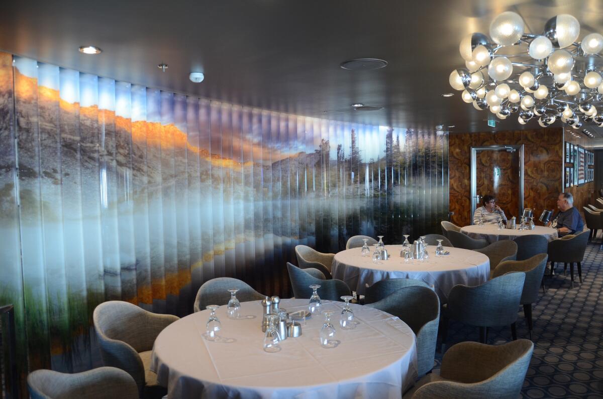 The American Icon dining room, seen here, is one of more than a dozen restaurants aboard.
