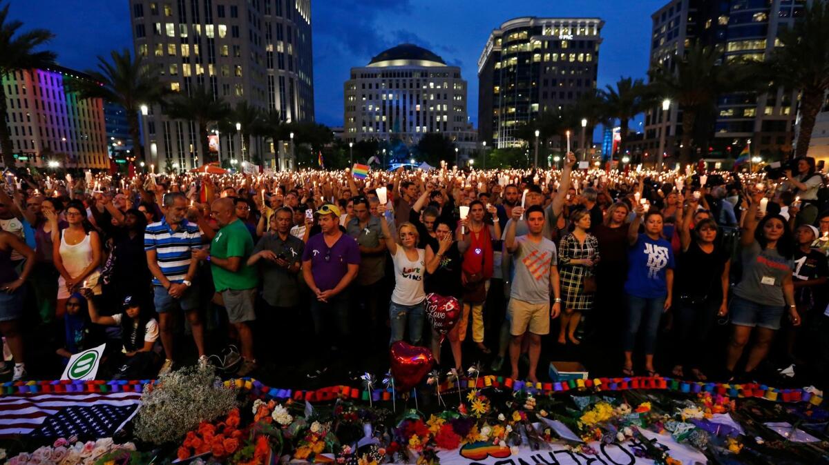 Thousands gather for a memorial rally in downtown Orlando after the nightclub attack.