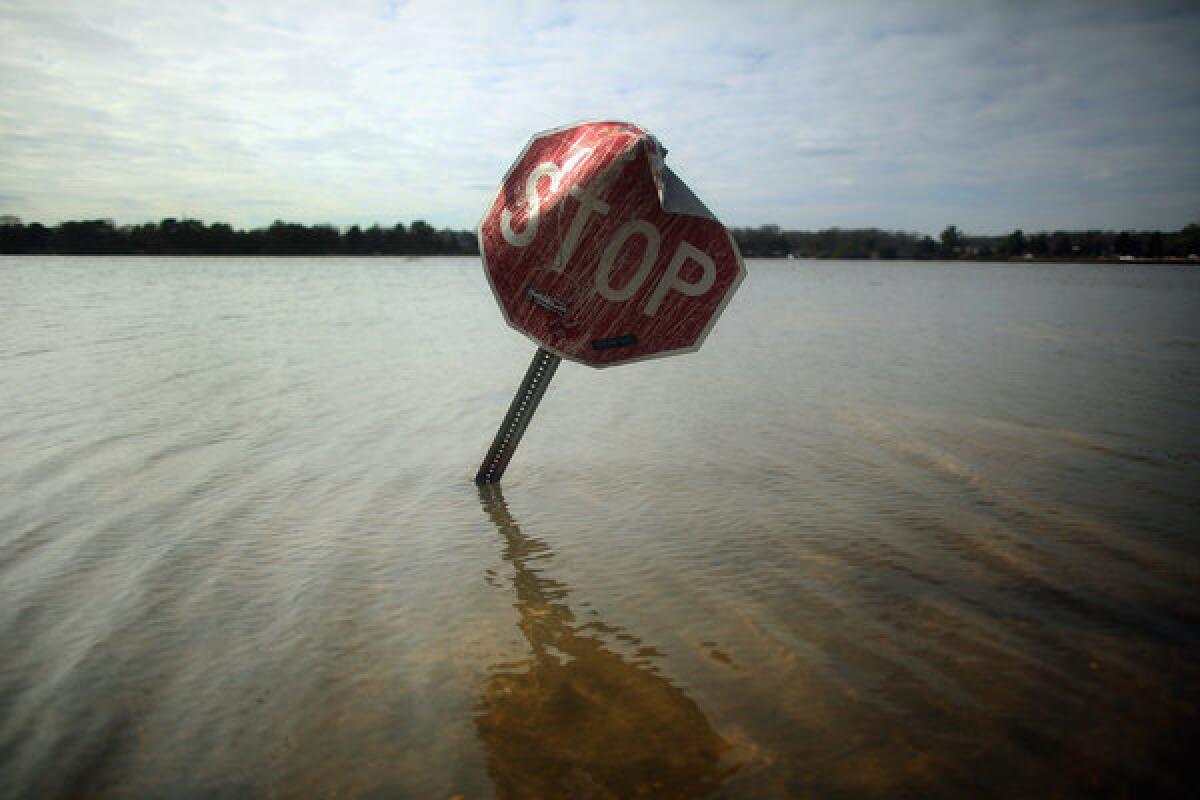 Floodwaters surround a stop sign in Bay Head, N.J.