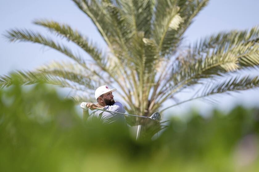 Captain Jon Rahm of Legion XIII GC hits his shot from the second tee during the first round of LIV Golf Jeddah at the Royal Greens Golf & Country Club on Friday, March 1, 2024, in King Abdullah Economic City, Saudi Arabia. (Charles Laberge/LIV Golf via AP)