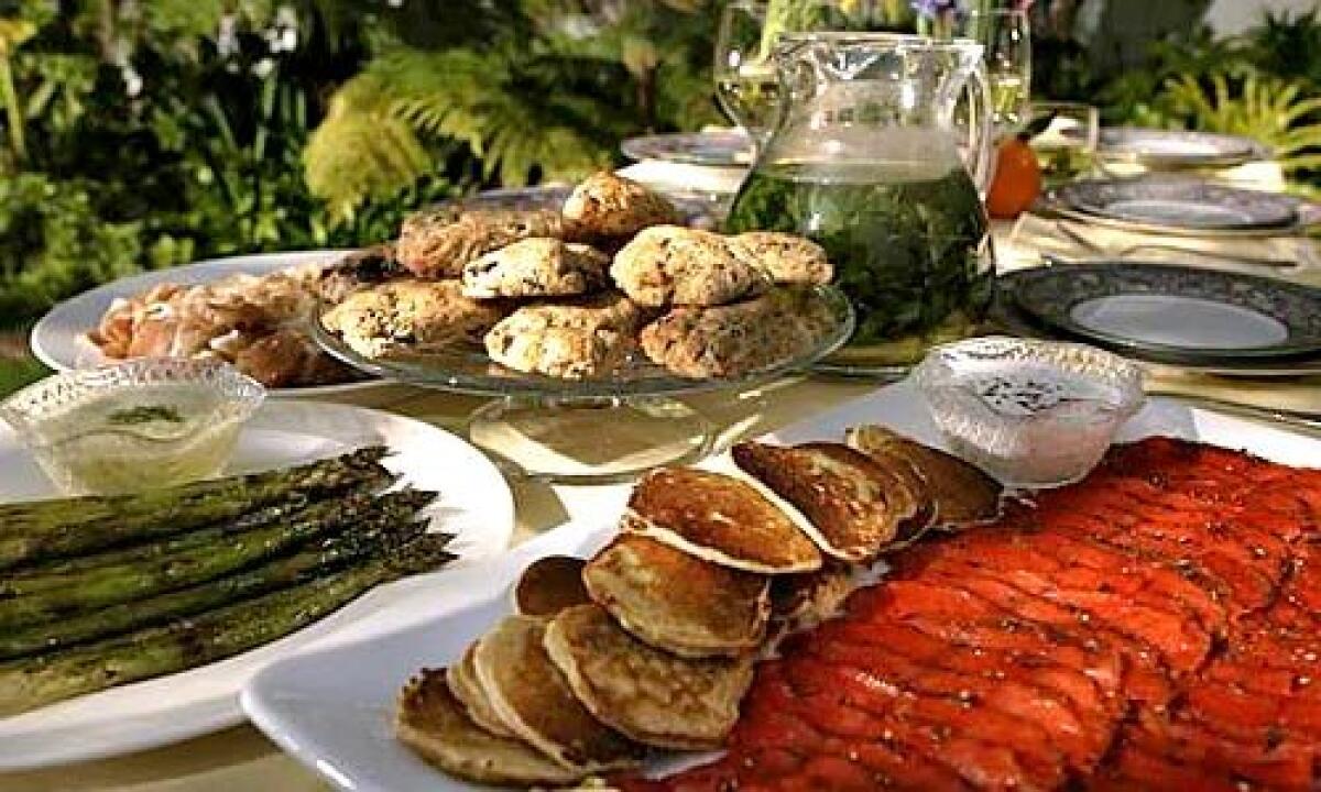 A FRESH TABLE: Chocolate-orange scones, a pitcher of tisane, leek pancakes and fennel-aquavit gravlax with caraway crème fraîche.