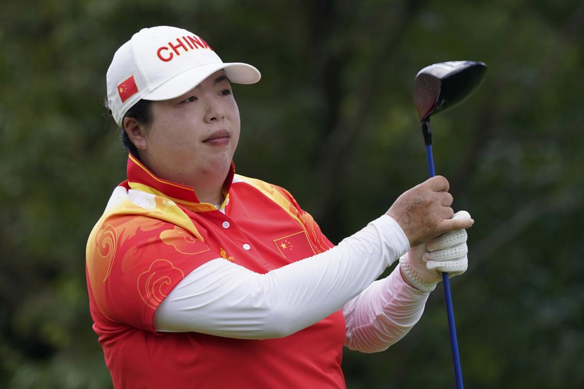 FILE - Shanshan Feng, of China, competes during the final round of the women's golf event at the 2020 Summer Olympics, on Aug. 7, 2021, at the Kasumigaseki Country Club in Kawagoe, Japan. Feng, the first Chinese player to win a major, has announced her retirement from the LPGA Tour. (AP Photo/Matt York, File)