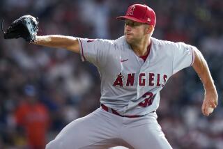 Los Angeles Angels starting pitcher Tyler Anderson delivers to a Houston Astros batter.