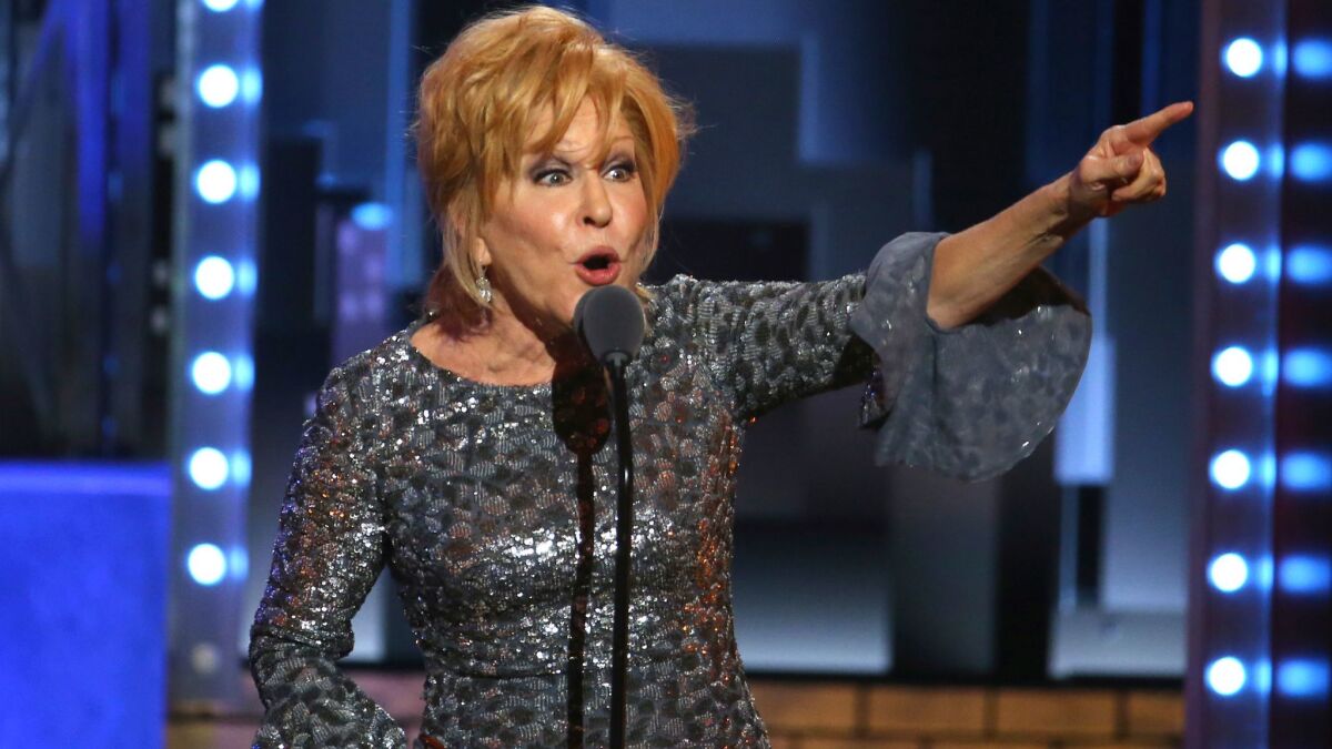 Bette Midler accepts the award for lead actress in a musical for "Hello, Dolly!" at the 71st Tony Awards.