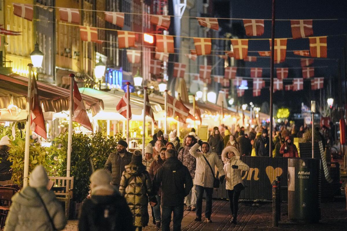 Danish flags hang over the waterfront