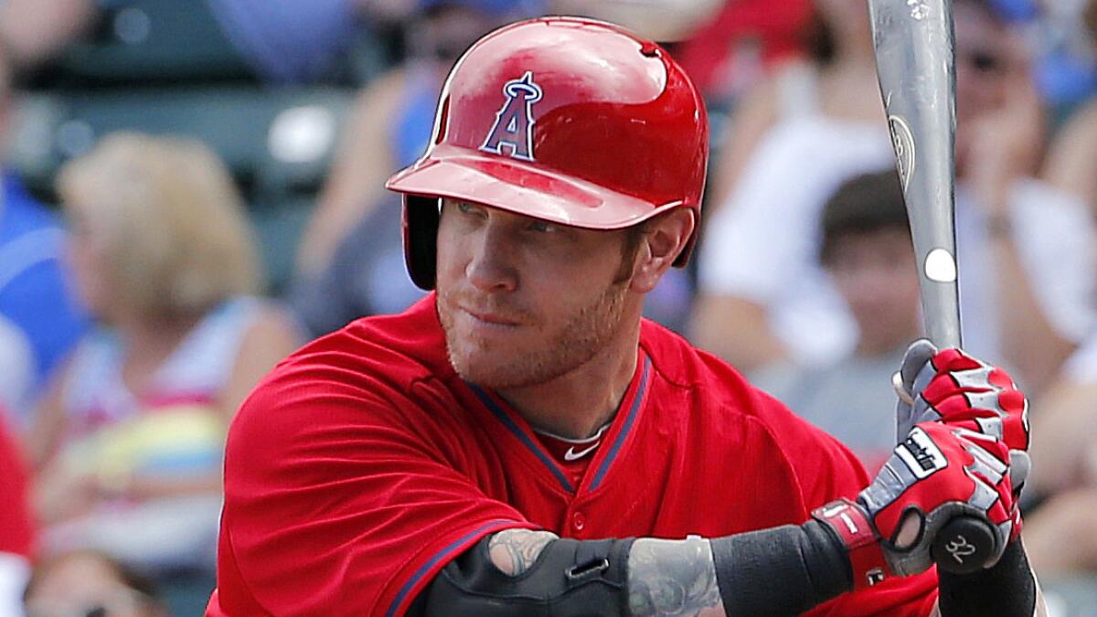 Angels outfielder Josh Hamilton takes a high fastball during a March 2014 exhibition game against the Chicago Cubs in Mesa, Ariz.