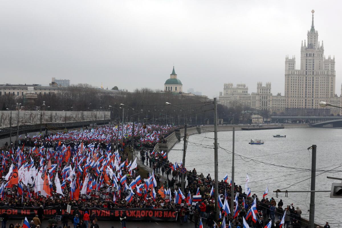 At least 20,000 people marched to the Kremlin on Sunday to mourn the loss of key opposition figure Boris Nemtsov, slain Friday night in a contract-style killing.