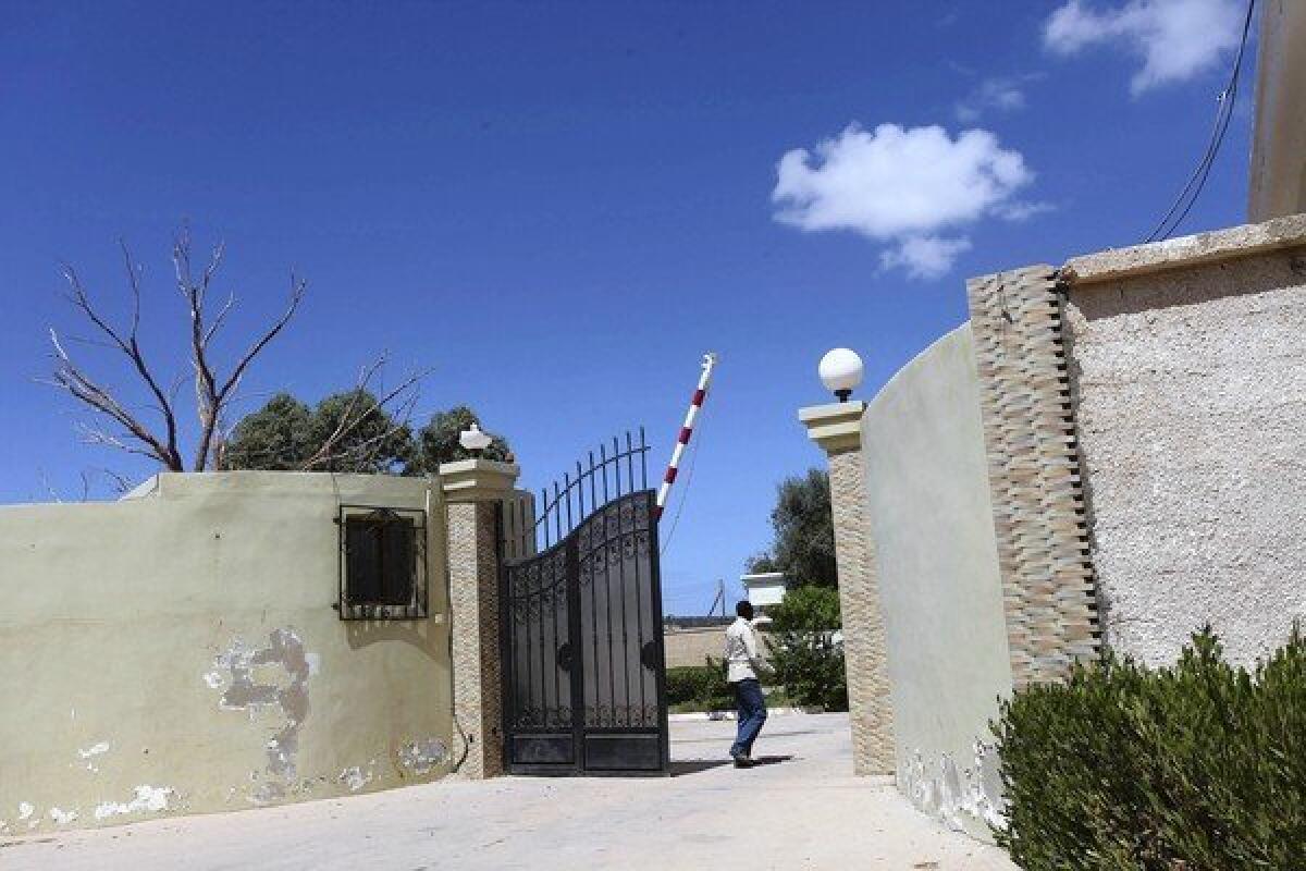 A man in Benghazi, Libya, makes his way near the safe house that was raided after the attack that killed U.S. Ambassador J. Christopher Stevens on Sept. 11.