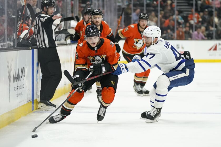 Toronto Maple Leafs' Pierre Engvall, right, pressures Anaheim Ducks' Troy Terry.